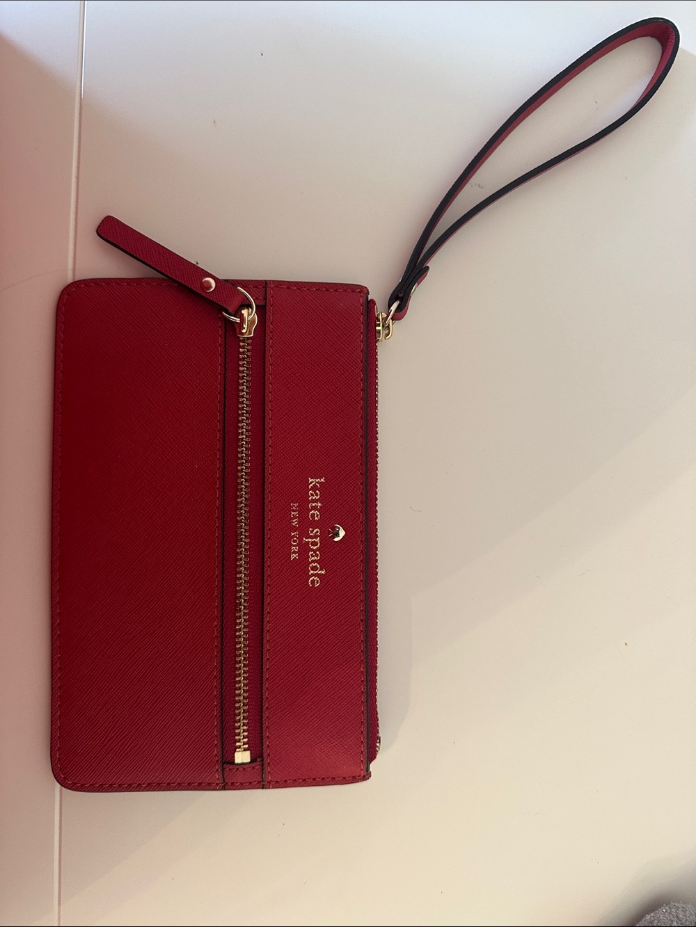 Kate Spade red zip wristlet with front pocket